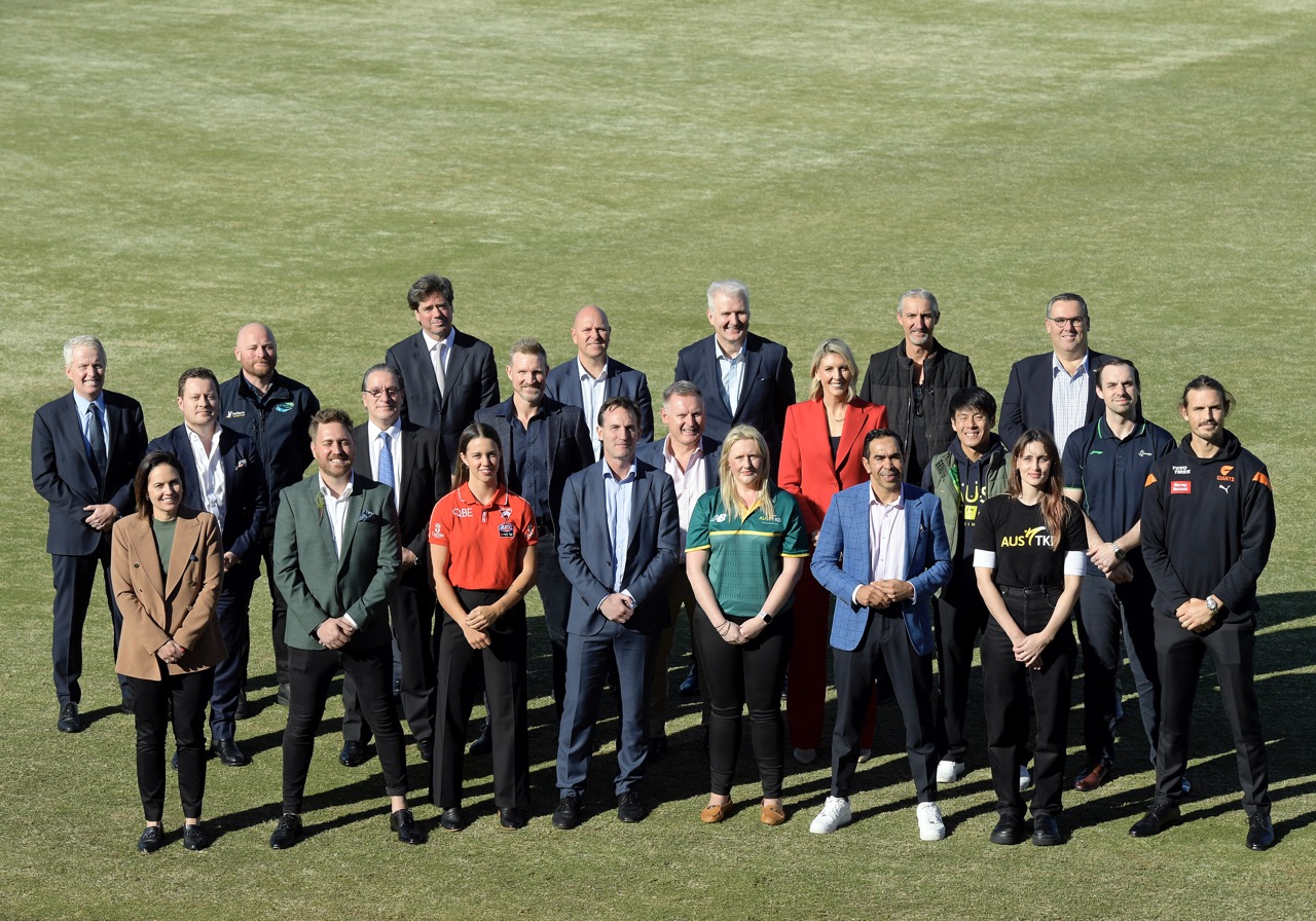 Motorsport Australia CEO Eugene Arocca standing alongside sporting leaders and identities at a recent event in Melbourne